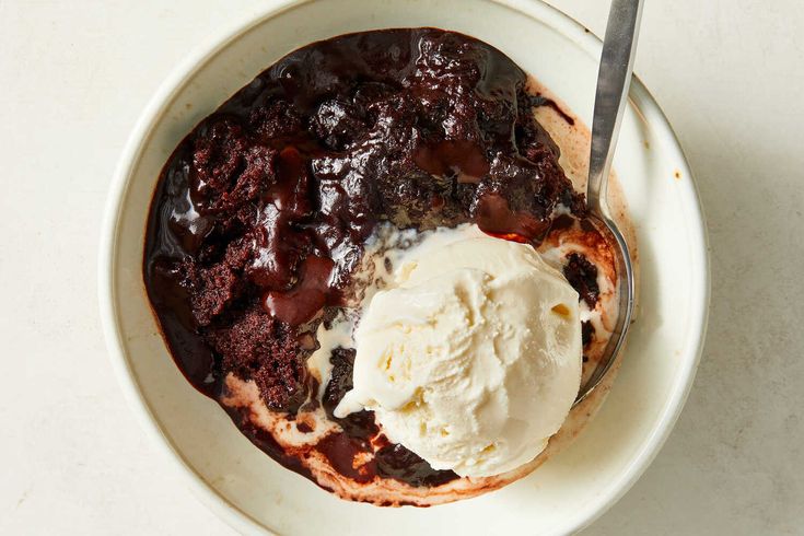 a bowl filled with ice cream and chocolate pudding