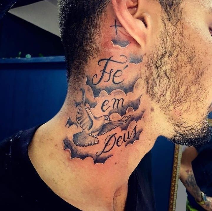 a man with a cross and dove tattoo on his neck