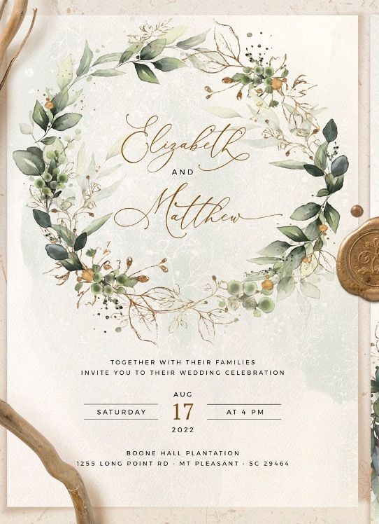 an elegant wedding card with greenery and gold lettering on the front, along with a green ribbon