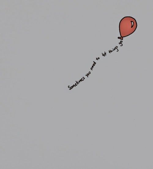 a red balloon flying in the sky with a message written on it's side