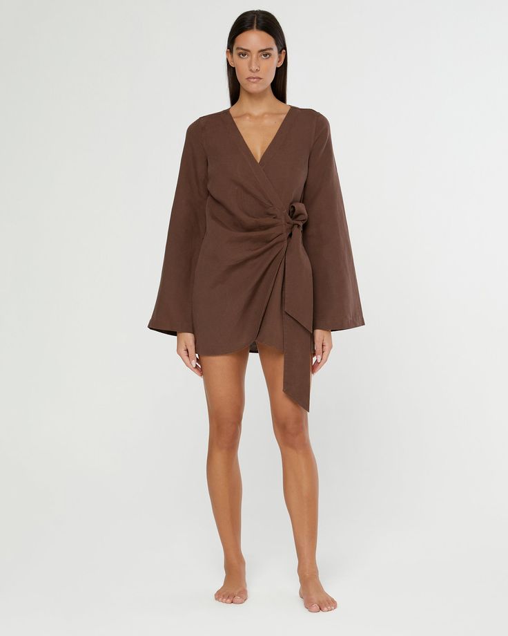 Designed in a mini crossover silhouette, this Air Linen Wrap Dress is cut from a breezy rayon-linen blend, with wide sleeves and a functional side tie. Chic Brown Linen Dress For Spring, Chic Linen Wrap Dress With Tie Waist, Chic Linen Mini Dress With Long Sleeves, Chic Linen Wrap Dress, Chic Long Sleeve Linen Mini Dress, Chic Fitted Linen Wrap Dress, Chic Brown Linen Dress, Chic Linen Long Sleeve Mini Dress, Casual Knee-length Linen Wrap Dress