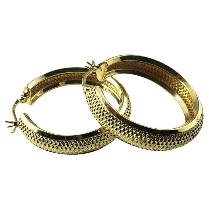 Vintage 14 Karat Yellow Gold Textured Hoop Earrings- These elegant hoop earrings are crafted in beautifully detailed 14K yellow gold. Width: 7.2 mm Size: 31.5 mm Weight: 5.5 gr./ 3.5 dwt. Stamped: Israel A585 Very good condition, professionally polished. Will come packaged in a gift box or pouch (when possible) and will be shipped U.S. Priority Mail Insured. DV092523/17KCS Gold Texture, Jewelry Earrings Hoops, Priority Mail, Gift Box, Jewelry Earrings, Hoop Earrings, Pouch, Yellow Gold, Texture