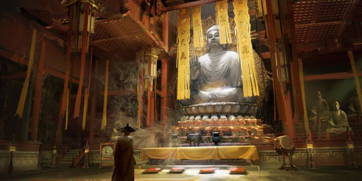 a large buddha statue sitting in the middle of a room