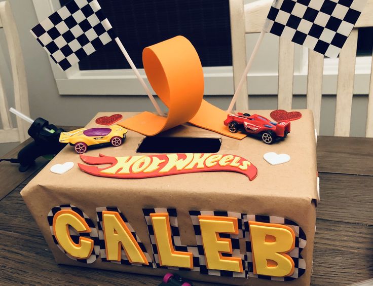 a cake made to look like a box with cars on it