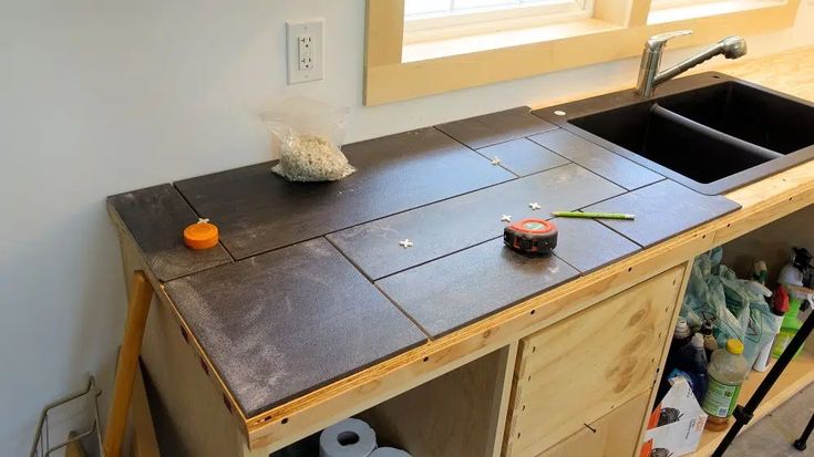 a kitchen counter that has been made out of plywood and is being worked on