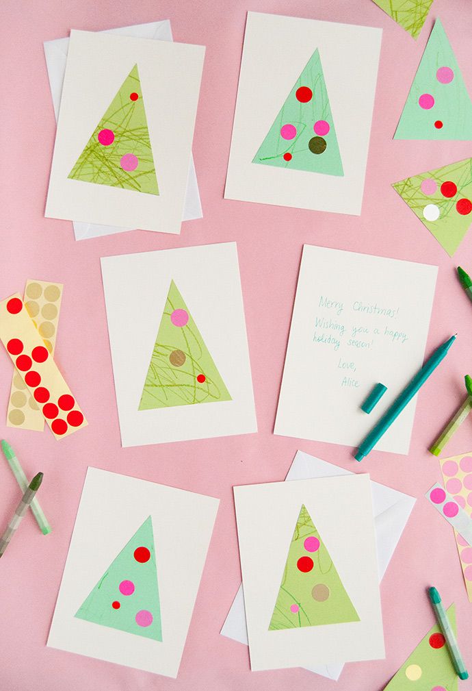 paper christmas tree cards with crayons on pink background