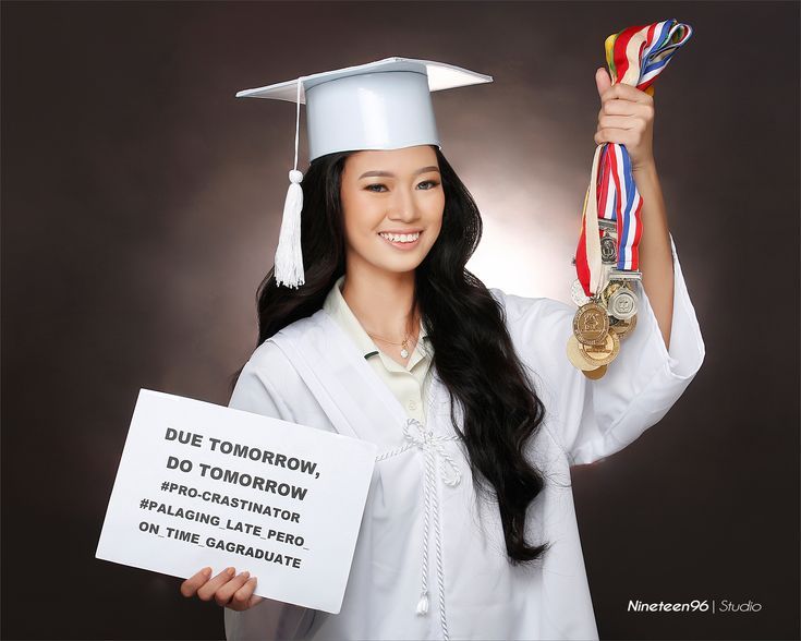 a woman in a graduation cap and gown holding up a sign that says due tomorrow, do tomorrow