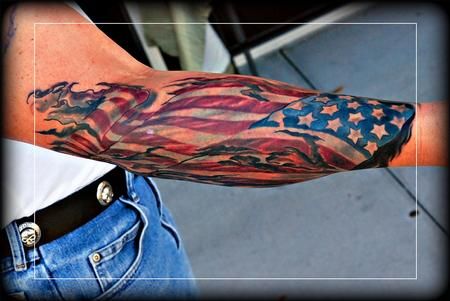 an american flag tattoo on the arm