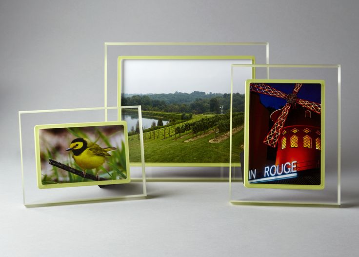 three different frames with pictures of birds and windmills in the middle one is yellow, the other is green