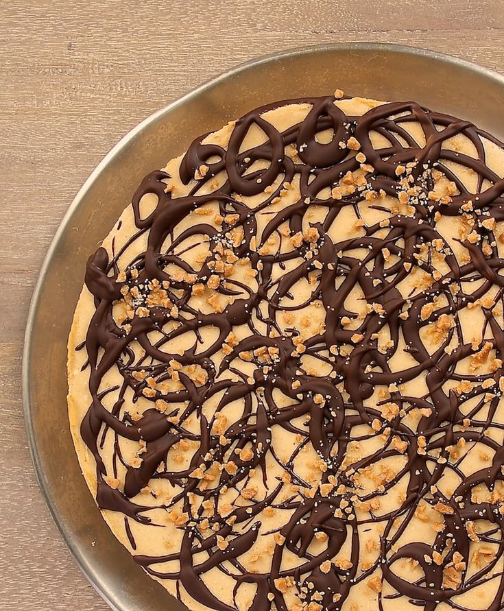 a chocolate and peanut butter pie on a metal pan