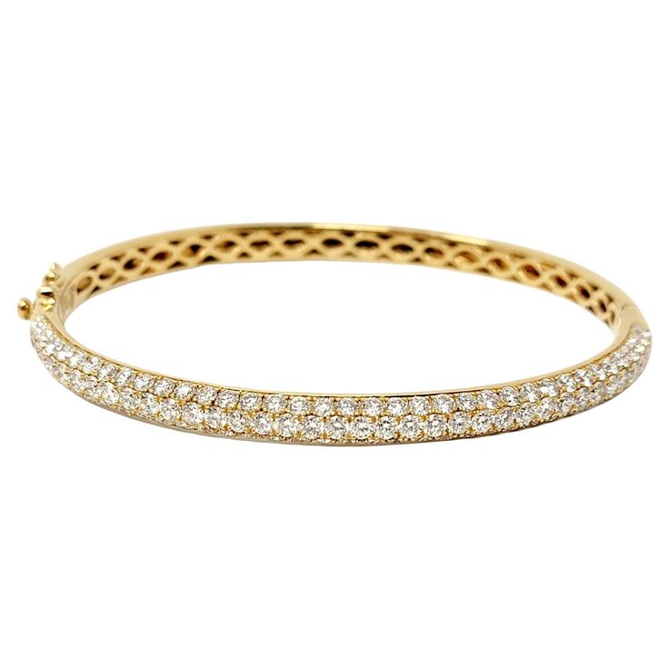 Absolutely beautiful pave diamond bangle bracelet by Oliver Smith Jeweler. The sleek, modern design bursts with sparkle from all angles from the stunning natural icy white diamonds. This incredible piece can be stacked with other bracelets or worn simply on its own, offering a glimpse of understated elegance. This beautiful bracelet is made of polished 18 karat white gold and features a hinged side opening. The top half of the bracelet is set with 4.02 carats of round pave diamonds in 3 elongate Oliver Smith, Diamond Bangle Bracelet, Pave Bracelet, Diamond Bangles Bracelet, Diamond Bangle, Yellow Gold Bracelet, Hinged Bangle, Pave Diamonds, Beautiful Bracelet