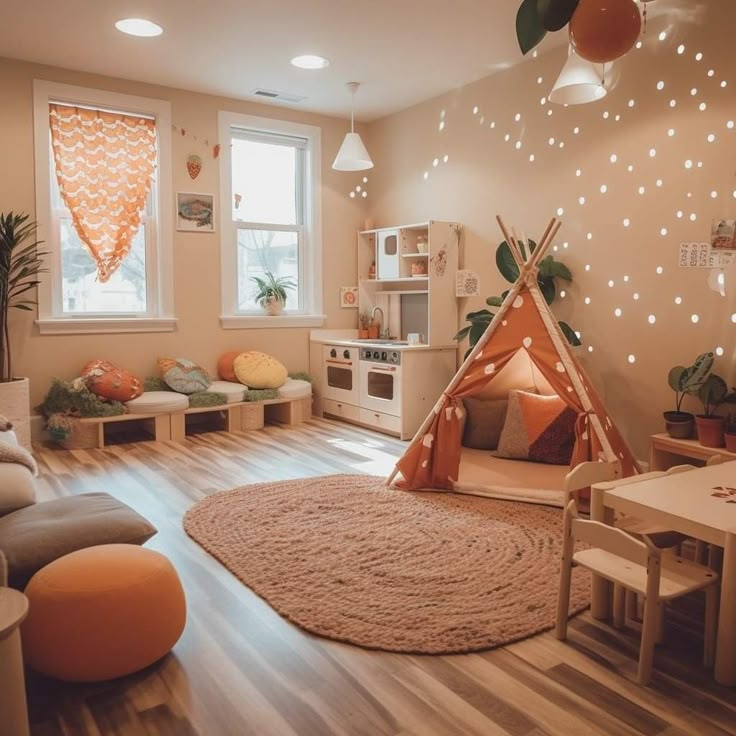 a child's playroom with a teepee tent in the corner