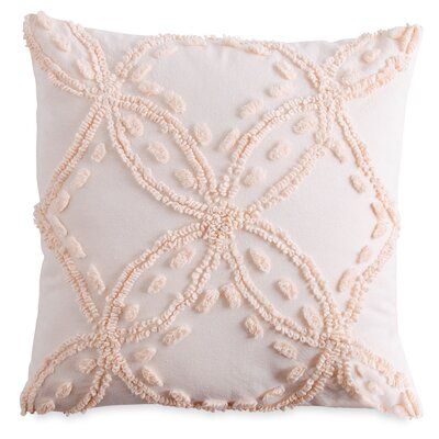 an embroidered pillow on a white background