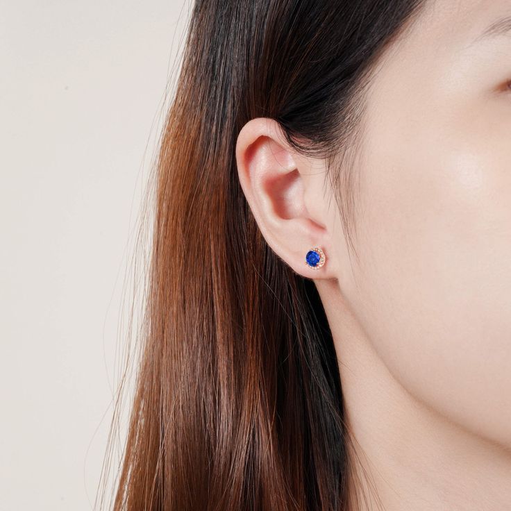 Add a little luxury, class, and sophistication to your look with our breathtaking Jia sapphire earrings. Made from our stunning gold on sterling silver materials, each iconic earring features a whopping 0.75-carat center sapphire. We’ve also added numerous stunning CZ crystals around the outer rim of the earrings for an unrivaled shine. ✦ DETAILS ✦ ✧ Handcrafted ✧ .75 Carat center stone ✧ Sapphire and cz crystals ✧ 8mm (about 6/8 inch round) ✧ Sterling Silver 925 or 14K Rose Gold Vermeil or 14K Birthstone Earrings Round Cut, Classic Sapphire Birthstone Earrings, Elegant Birthstone Diamond Earrings, Sapphire Birthstone Earrings In Fine Jewelry, Classic Sapphire Earrings In 14k Gold, Sapphire Birthstone Earrings Fine Jewelry, Classic 14k Gold Sapphire Earrings, Fine Jewelry Diamond Birthstone Earrings, Classic Blue Earrings For Everyday