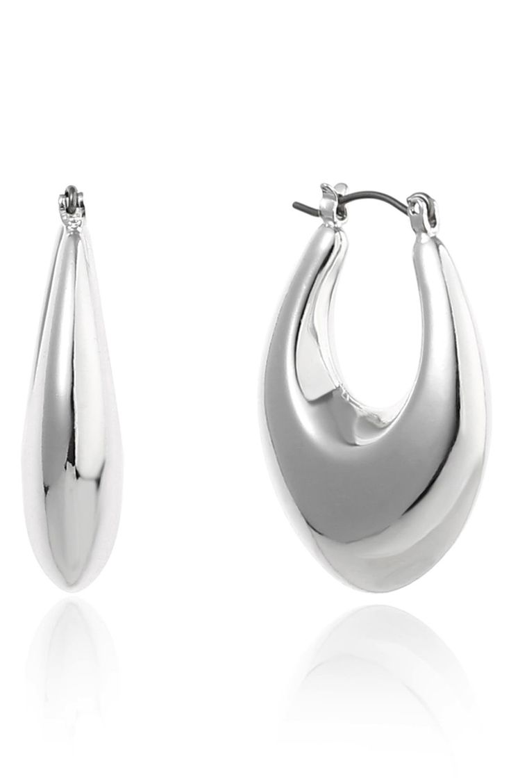 Slender teardrop-shaped hoops offer contemporary appeal to a classic jewelry staple. 1 1/4" drop; 7/8" width Snap-post closure Silvertone plate Imported Modern Metal Drop Earrings For Pierced Ears, Modern Metal Teardrop Earrings, Metal Teardrop Hoop Earrings, Modern Metal Drop Hoop Earrings, Modern Small Hoop Teardrop Earrings For Pierced Ears, Teardrop Hoop Earrings With Polished Finish For Formal Occasions, Teardrop Hoop Earrings With Polished Finish For Formal Events, Modern Metal Teardrop Earrings For Formal Occasions, Modern Silver Teardrop Hoop Earrings