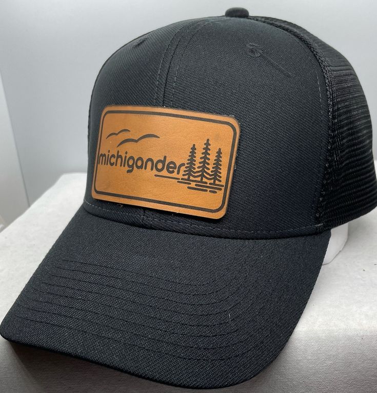 Michigander Hat Michigan Proud Perfect Gift For any Michigander Black Dad Hat Adjustable Closure Unisex Ships Fast Each piece of leather will vary.. no two piece are the same The hat is shown in a glued finish & a stitched finish please choose your finish at check out Wholesale Availability Adjustable Leather Trucker Hat, Black Hat With Leather Patch, One Size Fits Most, Black Hat With Leather Patch One Size, Black Hats With Leather Patch, Black Hat With Leather Patch, Black Leather Trucker Hat With Leather Patch, Black Hat With Leather Backing And Curved Brim, Black Leather Hat With Leather Patch, Black Leather Trucker Hat For Outdoor