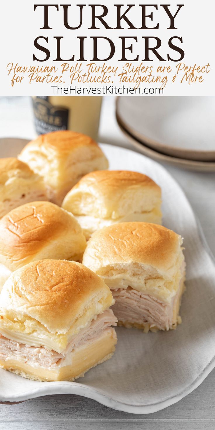 turkey sliders on a white plate with a cup of coffee in the background