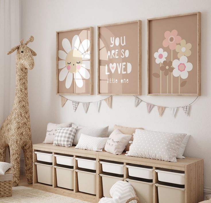 a child's room decorated in pink, white and beige with llamas on the wall