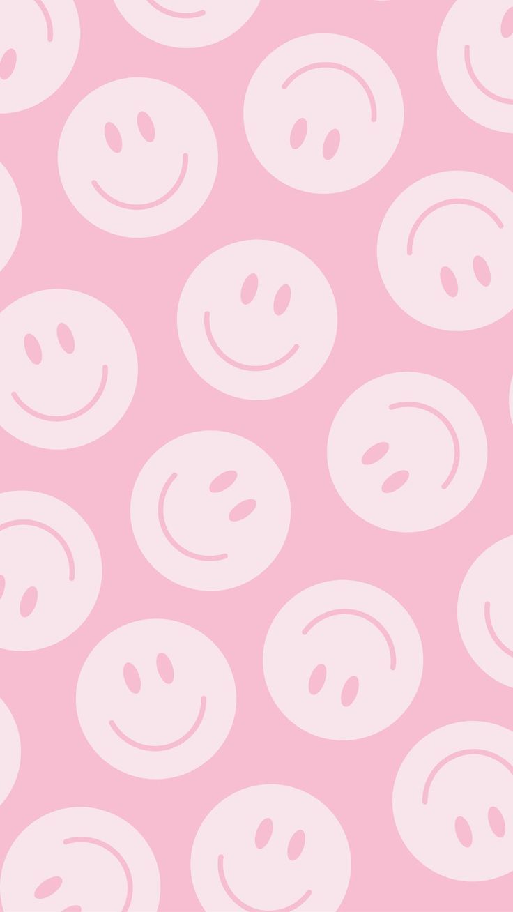 a pink background with smiley faces on it