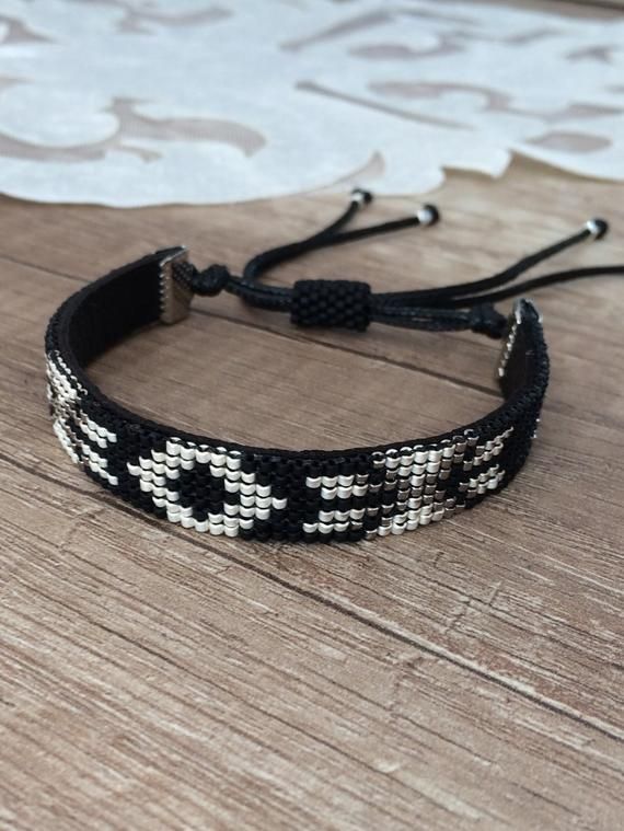 Beaded Tribal Bracelet Native American Bracelet Ethnic Boho | Etsy  #bohojewelry #nativeamericanjewelry  #nativeamerican #blackbracelet #valentinesday #tribaljewelry #handmadejewelry #bohochic #ethnicjewelry #etsyshop #loombeading #birthdaygifts #bohemianstyle #handmadebracelet #giftforher #etsyfinds Bohemian Bangle Jewelry With Sliding Knot, Bohemian Bracelets With Sliding Knot, Bohemian Hand-strung Wristband As Gift, Traditional Beaded Bracelets With Sliding Knot For Festivals, Handmade Black Cuff Bracelet For Festivals, Bohemian Silver Beaded Bracelets With Sliding Knot, Adjustable Southwestern Jewelry With Black Beads, Traditional Beaded Bracelet With Sliding Knot For Festivals, Traditional Beaded Bracelet With Sliding Knot