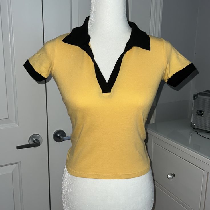 - One Size (Fits Like A Xs/S) - Mustard Yellow With Black Around The Collar And Sleeves - Never Worn Before - Brand New Without Tags! Yellow Stretch Y2k Top, Stretch Yellow Y2k Tops, Fitted Yellow Cotton Top, Yellow Fitted Trendy Top, Fitted Trendy Yellow Top, Trendy Fitted Yellow Top, Yellow Fitted Y2k Top, Fitted Yellow Y2k Tops, Yellow Fitted Vintage Tops