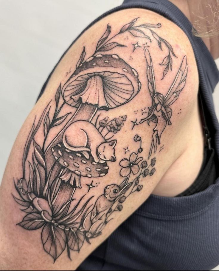 a woman's arm with mushrooms and flowers tattoo on the left side of her body