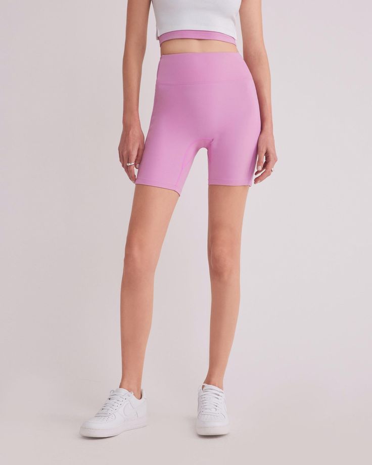 DETAILS: Color: Bubble gum pink High waist biker shorts with side contrast fabric Super soft & delicate brushed body fabric Medium weight 2x2 ribbed fabric on side panel Rubberized brand logo detail at back waist Body: 77% Nylon, 23% Spandex Contrast fabric: 93% Polyester, 7% Spandex Machine wash SIZE & FIT: Fits true to size Waist: 10 3/4" Inseam: 7" Model is wearing a size S Pink High Stretch Athletic Shorts For Sports, High Stretch Pink Athletic Shorts For Sports, High Stretch Pink Sports Shorts, Pink High Stretch Biker Shorts For Workout, High Stretch Pink Biker Shorts For Workout, Pink High-stretch Sports Shorts, High Stretch Pink Athleisure Shorts, Pink Training Shorts For Spring, High Waist High Stretch Pink Shorts