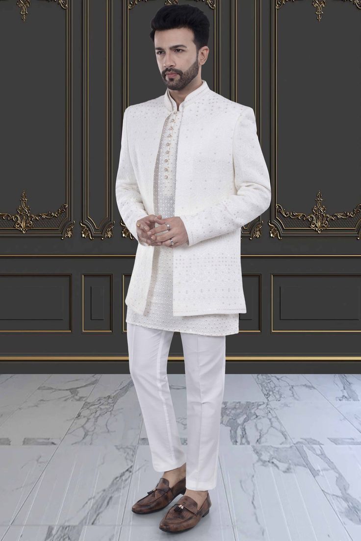 This men's sherwani, featuring elegant sequin and thread work, will elevate any occasion with its open jacket design. The intricate detailing adds a touch of luxury and sophistication. Made with high-quality materials, it is sure to impress with its stunning craftsmanship and modern yet traditional design. Elegant Sherwani With Pearl Embroidery For Diwali, Festive Fitted Kurta With Pearl Embroidery, Elegant Embroidered Sherwani For Designer Wear, Elegant Designer Embroidered Sherwani, Elegant Embroidered Designer Sherwani, Pearl Embroidered Nehru Jacket For Wedding And Eid, Elegant Designer Outerwear For Diwali, Elegant Sherwani With Chikankari Embroidery For Diwali, Elegant Embroidered Outerwear For Diwali