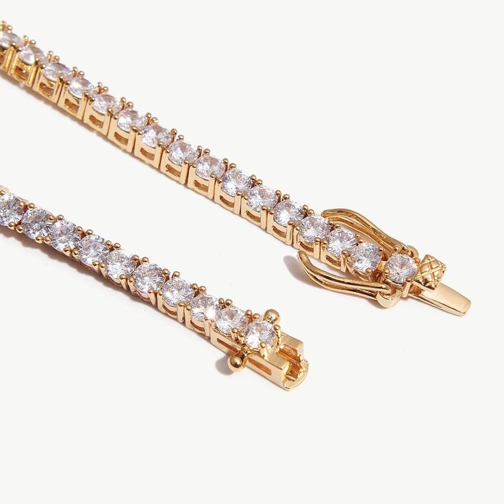 DetailsWidth: 3mmLength: 6 inchesWeight: 9.4gMaterialsMetal: Thick 18k Gold Plated on BrassGemstone: Cubic Zirconia💝ProductsAdd a touch of sophistication to your look with this delicate 3mm tennis bracelet in a beautiful gold color. Made with attention to detail. this bracelet is perfect for those who prefer a more subtle and understated accessory. Wear it alone or stack it with other bracelets for a chic and stylish look. 💙Item HighlightsAt the heart of this accessory lies our commitment to q Delicate Gold Tennis Bracelet With Cubic Zirconia, Delicate Gold Cubic Zirconia Tennis Bracelet, Elegant Gold Plated Tennis Bracelet With Diamond Accents, Elegant Gold-plated Tennis Bracelet With Diamond Accents, Gold Cubic Zirconia Tennis Bracelet For Wedding, Elegant Adjustable Jewelry With Handset Stones, Elegant Diamond Jewelry With Handset Stones, Delicate Gold Cubic Zirconia Diamond Bracelet, Delicate Gold Diamond Tennis Bracelet