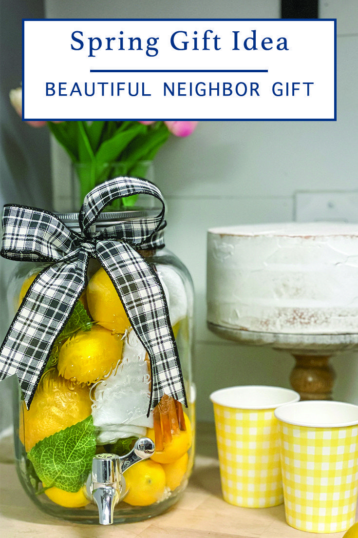 a glass jar filled with lemons and ice