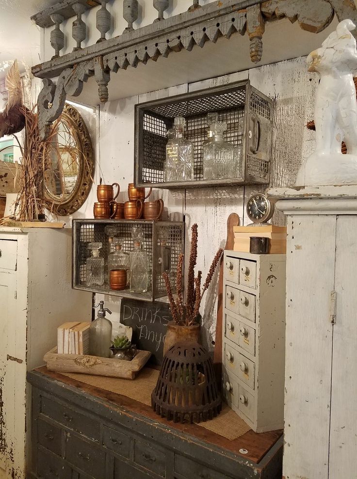 an old fashioned kitchen with lots of pots and pans