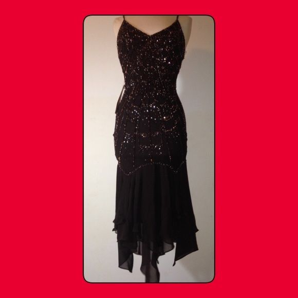 Bicici Dark Brown Sequined Party Dress...SZ SMALL Retail at $359.00. Lustrous sequins coat the fitted sweetheart bodice of a silky, showstopping short gown while streaming in, sequin spider web design, finished with an asymmetrical skirt.  This showstopping dress is suspended from delicate silk and sequined spaghetti straps with all over showstopping spider web design on back of dress. 	•	Pull on 	•	Fully lined 	•	Dress is silk with spandex to            accentuate curves 	•	lining is polyester; 	•	Dry clean. 	•	imported. 	•	Special Occasion. Bicici Dresses Elegant Fitted Flapper Dress For Prom Season, Glamorous Fitted Flapper Evening Dress, Evening Fitted Flapper Dress, Elegant Evening Flapper Dress, Elegant Flapper Dress For Formal Party Season, Formal Fitted Flapper Dress, Elegant Holiday Flapper Dress For Party, Fitted Tea-length Dress For Prom Season, Elegant Sequined Flapper Dress For Formal Occasions