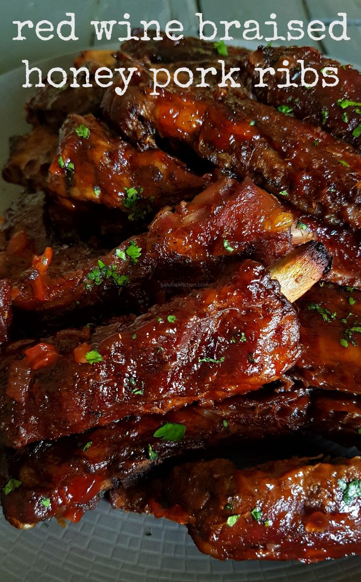 the ribs are covered in bbq sauce and garnished with parsley