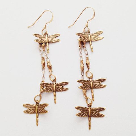 two gold dragonflys dangling from chain earrings