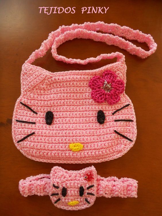 a crocheted hello kitty purse and matching cat hat