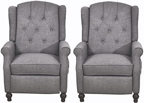 two gray chairs sitting next to each other