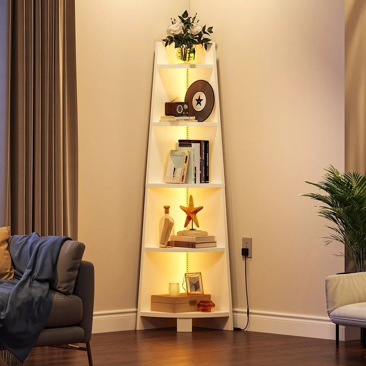 a living room with a couch, chair and book shelf