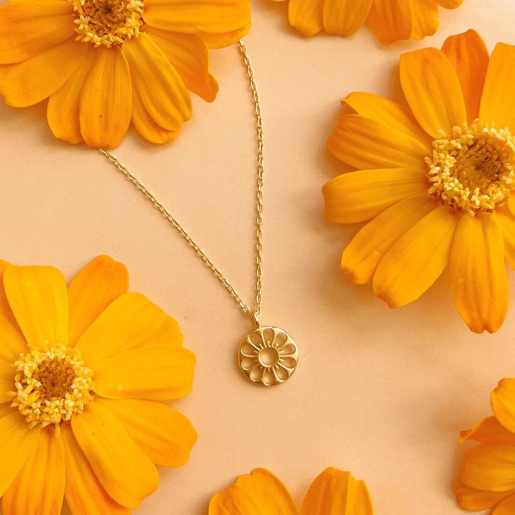 The Daisy Necklace the perfect addition to your favorite necklace stack or a sweet gift for the favorite guy or gal in your life. Designed in house by our very own Sunshine Studios, we're so proud of these gold vermeil necklaces that combine our love for 70's beach culture and dainty jewelry. Beach Culture, Circle Flower, Necklace Stack, Daisy Necklace, Sweet Gifts, The Favorite, So Proud, Dainty Jewelry, Flower Necklace