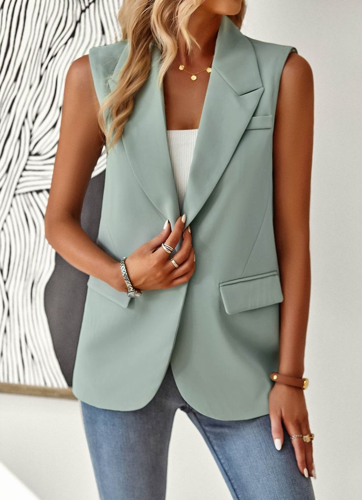 Introducing the Radford Blazer Vest - Sage. A versatile, stylish addition to any wardrobe. Combining the classic blazer silhouette with the comfort and convenience of a vest, this piece is perfect for any occasion. Dress it up or down, and stay on-trend with this must-have garment. Size Guide: Model is 5’8” tall, and has a 33.5” bust, 26.5” waist, & 36.2” hips. She is wearing a S / US 4 / AU 8. This vest is true to size. Material: Self: 90% Polyester 10% Spandex, Lining: 100% Polyester. Feature: Pocketed. Notched lapel. Sleeveless. Front button closure. Relaxed oversized fit. Care Instructions: Machine wash / Cold hand wash Elegant Blazer With Vest And Lapel Collar, Single Breasted Vest With Lapel Collar For Office, Classic Sleeveless Office Blazer, Single Breasted Office Vest With Lapel Collar, Fall Sleeveless Single Breasted Blazer, Fall Single Breasted Sleeveless Blazer, Fall Sleeveless Single-breasted Blazer, Elegant Solid Vest For Spring, Notch Lapel Business Vest For Fall