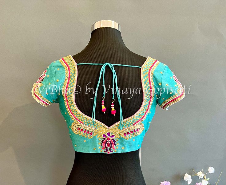 Experience the perfect balance of style and comfort with our Sky Blue With Pink Embroidered Blouse. Made with high-quality materials and intricate embroidery, this blouse will elevate your wardrobe and keep you looking chic all day long. Get yours now and make a statement with every wear. Trendy Blouses, Blouse Material, Fancy Sarees, Floral Print Blouses, Embroidered Blouse, Raw Silk, Indian Bride, Bridal Collection, Sky Blue