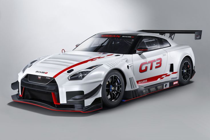 the nissan gt3 race car is shown in this image, it's white with red stripes