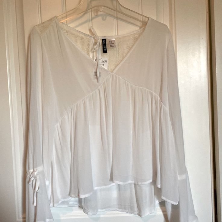 Sheer Blouse With Flares At Cuff With Decorative Ties And Lace On Upper Back. H&m V-neck Tops For Daywear, White Long Sleeve Blouse From H&m, White Long Sleeve Blouse By H&m, White Long Sleeve Blouse H&m, H&m White Long Sleeve Blouse, H&m V-neck Tops For Day Out, Elegant H&m Shirt For Spring, H&m Spring Daywear Shirt, H&m Spring Shirt