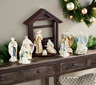 a christmas scene with nativity figurines on a table