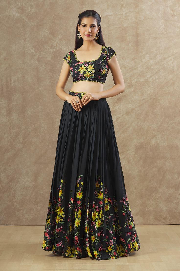 Black georgette lehenga with an attached cancan, floral print and sequins and beaded hand embroidered waistband. Comes with a padded blouse. Components: 2 Pattern: Printed, Hand embroidered Type Of Work: Floral, Sequins, Beads Neckline: Round Sleeve Type: Short Fabric: Georgette Color: Black Other Details:  Attached lining Lehenga length : 45 inches Approx Product Weight : 2 Kgs Closure : Drawstrings Occasion: Sangeet - Aza Fashions Ombre Lehenga, Georgette Lehenga, Round Pattern, Padded Blouse, Beaded Neckline, Pattern Blouse, Designer Gowns, Blouse Patterns, Formal Shirts