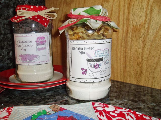 two jars filled with food sitting on top of a counter