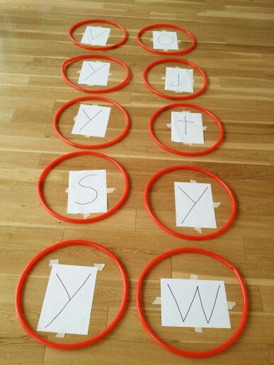 the paper is cut out and placed on the floor to make a circle with scissors