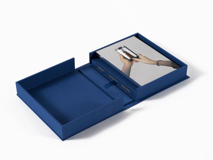 an open blue box with a photo inside