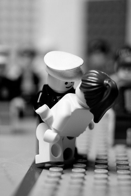 a black and white photo of a lego figure