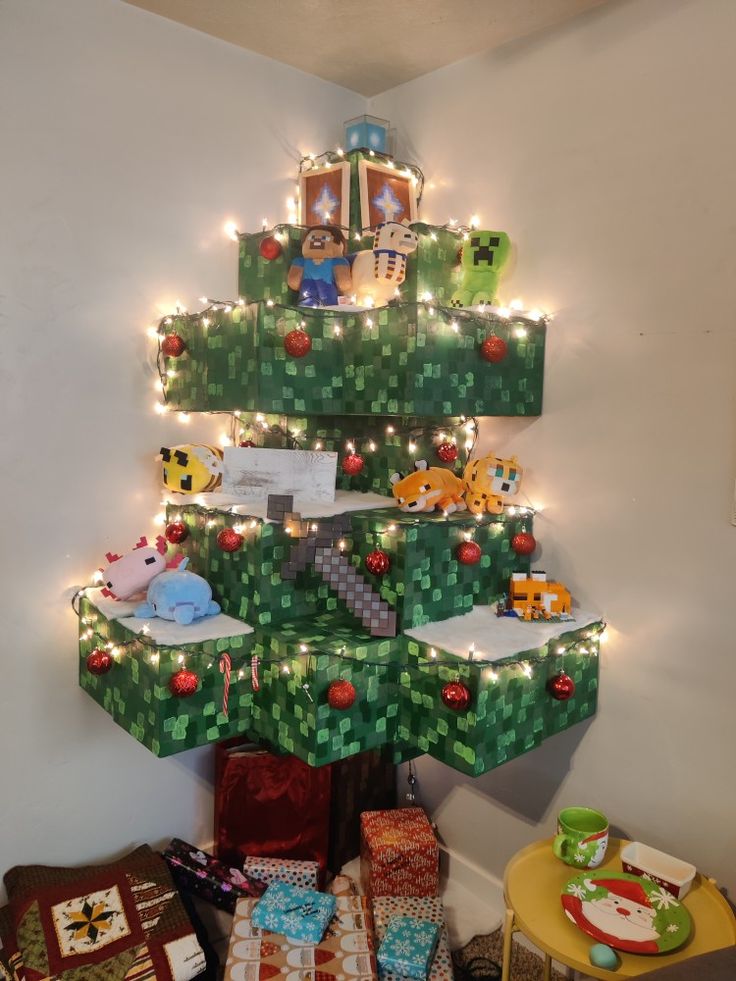 a christmas tree made out of legos with lights on it and presents under the tree