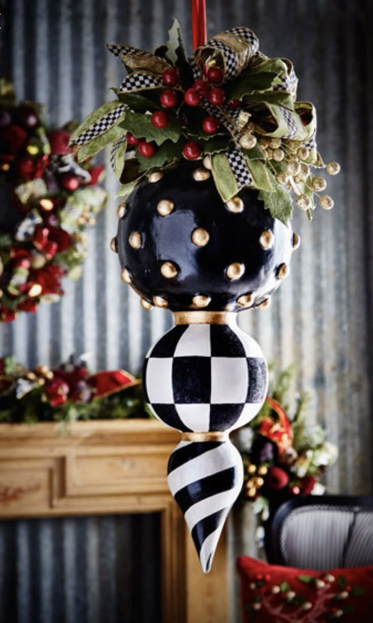 a black and white christmas ornament hanging from the ceiling